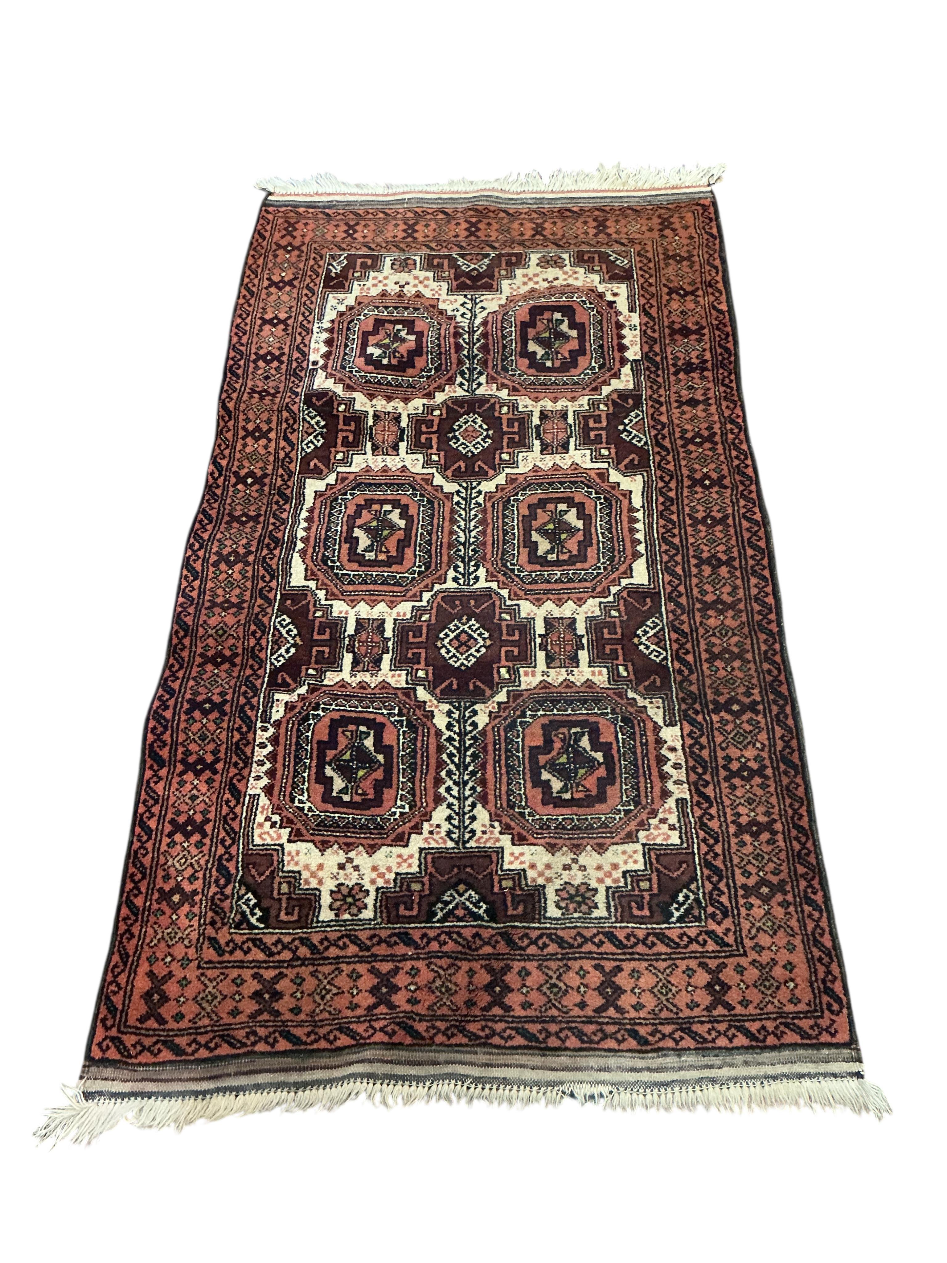 A Bokhara red ground runner and smaller rug, larger 300 x 78cm